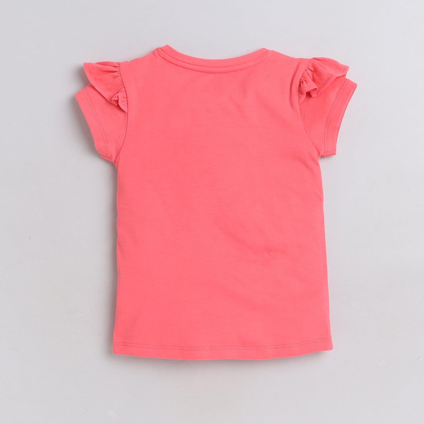 Pink t-shirt with ruffled sleeves on a gray background